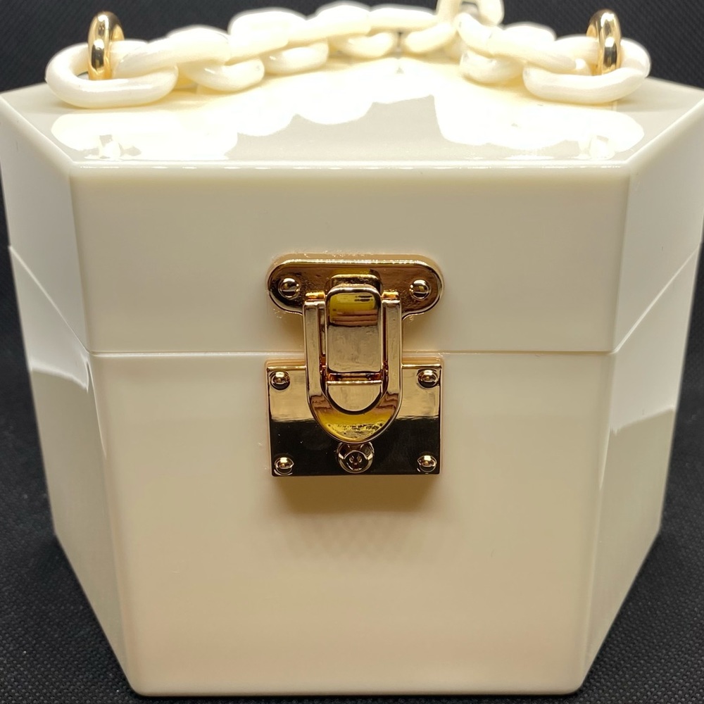 Hexagon shaped hard shell decorative purse.
